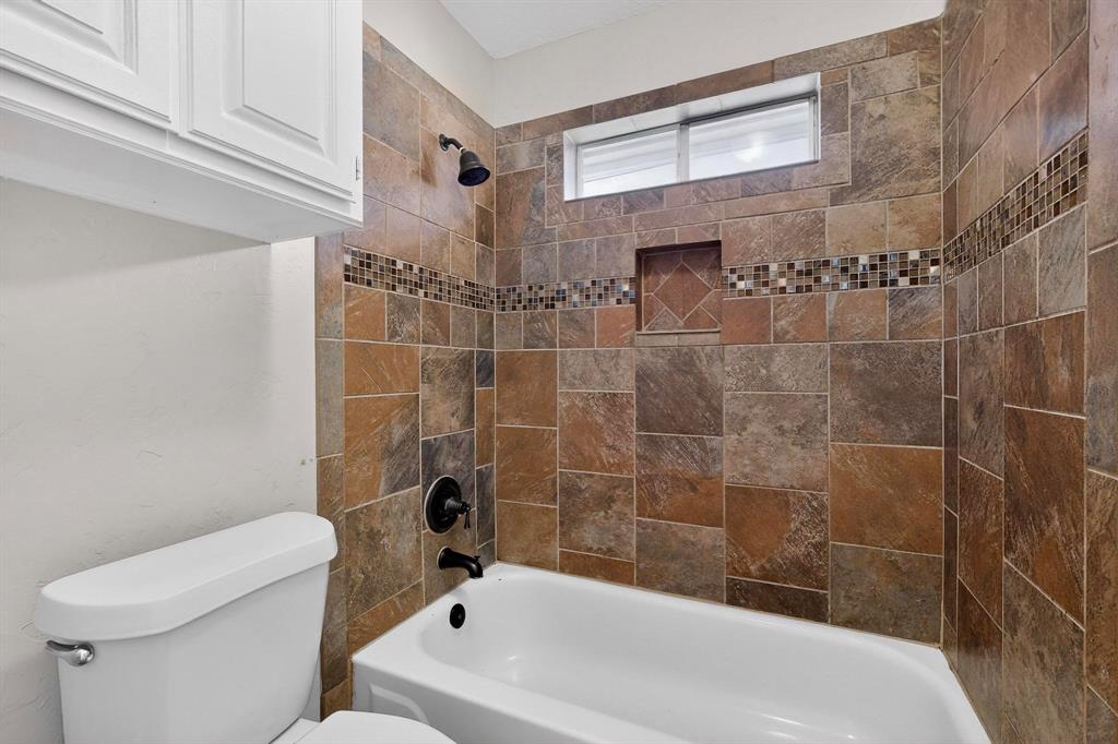 2601 Trail Tree Court Burleson, TX 76028 - Photo 32 of 40 Full bath featuring toilet and tub / shower combination
