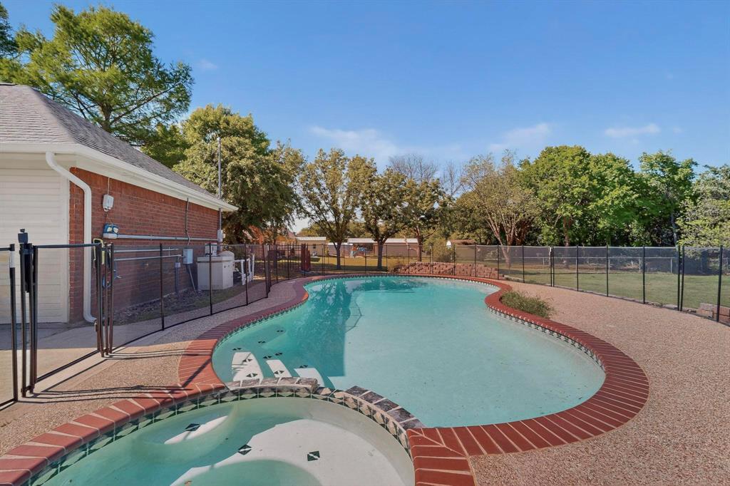2601 Trail Tree Court Burleson, TX 76028 - Photo 35 of 40 Integrated pool / hot tub with a fenced backyard and a patio