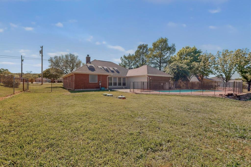 2601 Trail Tree Court Burleson, TX 76028 - Photo 38 of 40 Back of house with a chimney, a patio area, and brick siding