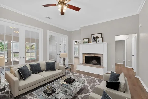 a living room with furniture and a fireplace