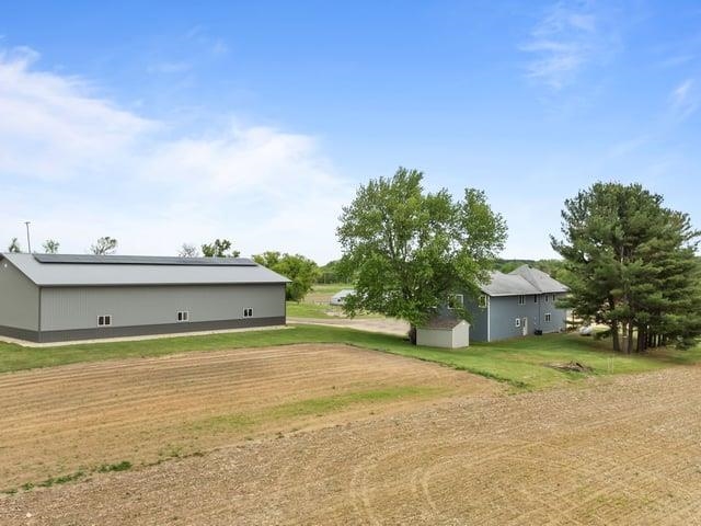 8294 North Leaf River Road Leaf River, IL 61047 - Photo 50 of 56 a view of a big room with large trees and a yard