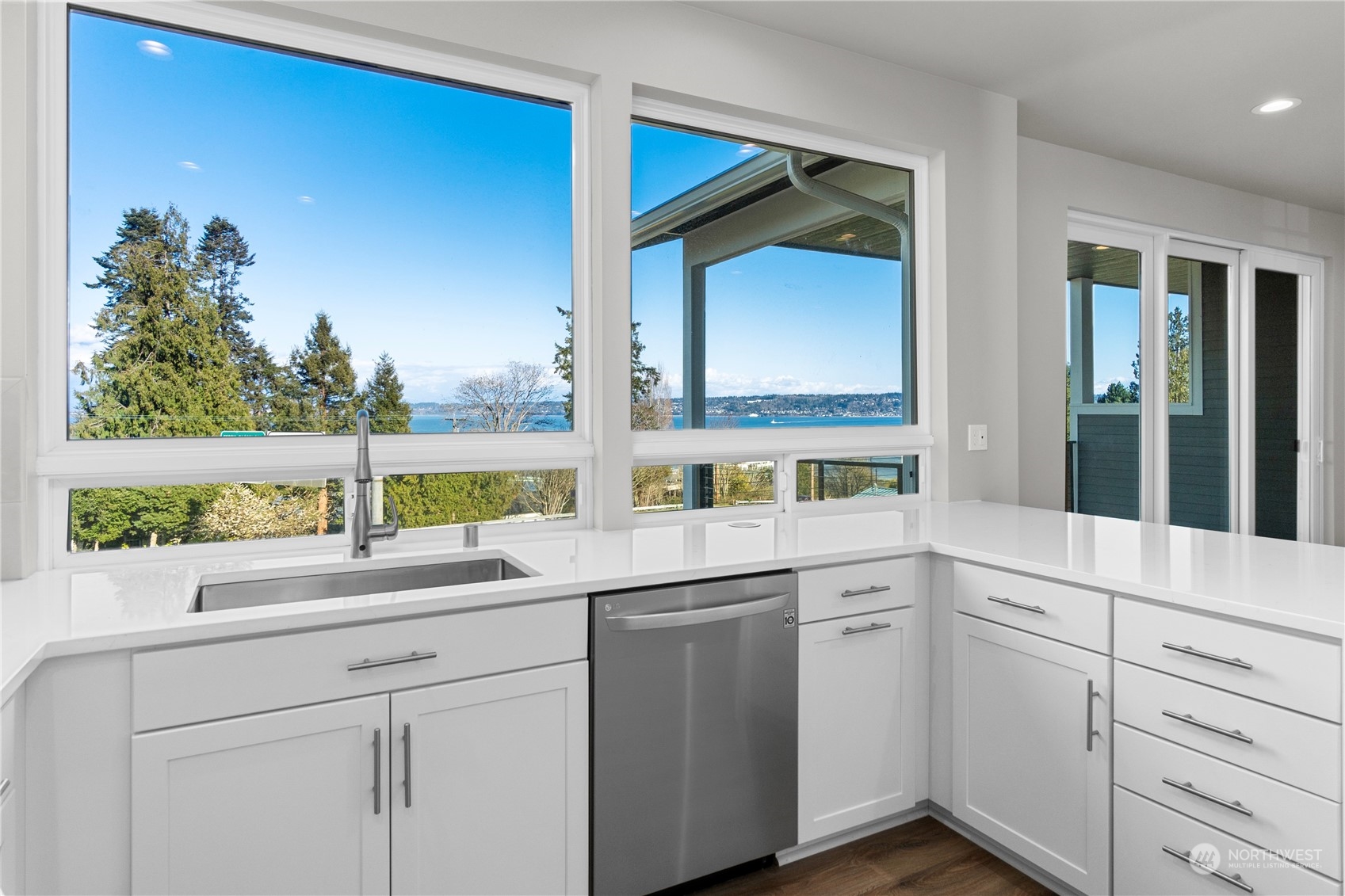 6441 Humphrey Road, Unit 4 Clinton, WA 98236 - Photo 1 of 40 a kitchen with a sink and cabinets
