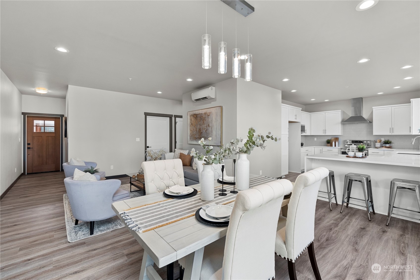 6441 Humphrey Road, Unit 4 Clinton, WA 98236 - Photo 11 of 40 a view of a dining room with furniture and wooden floor