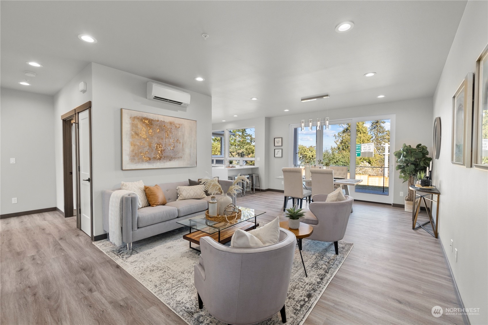 6441 Humphrey Road, Unit 4 Clinton, WA 98236 - Photo 14 of 40 a living room with furniture and a wooden floor