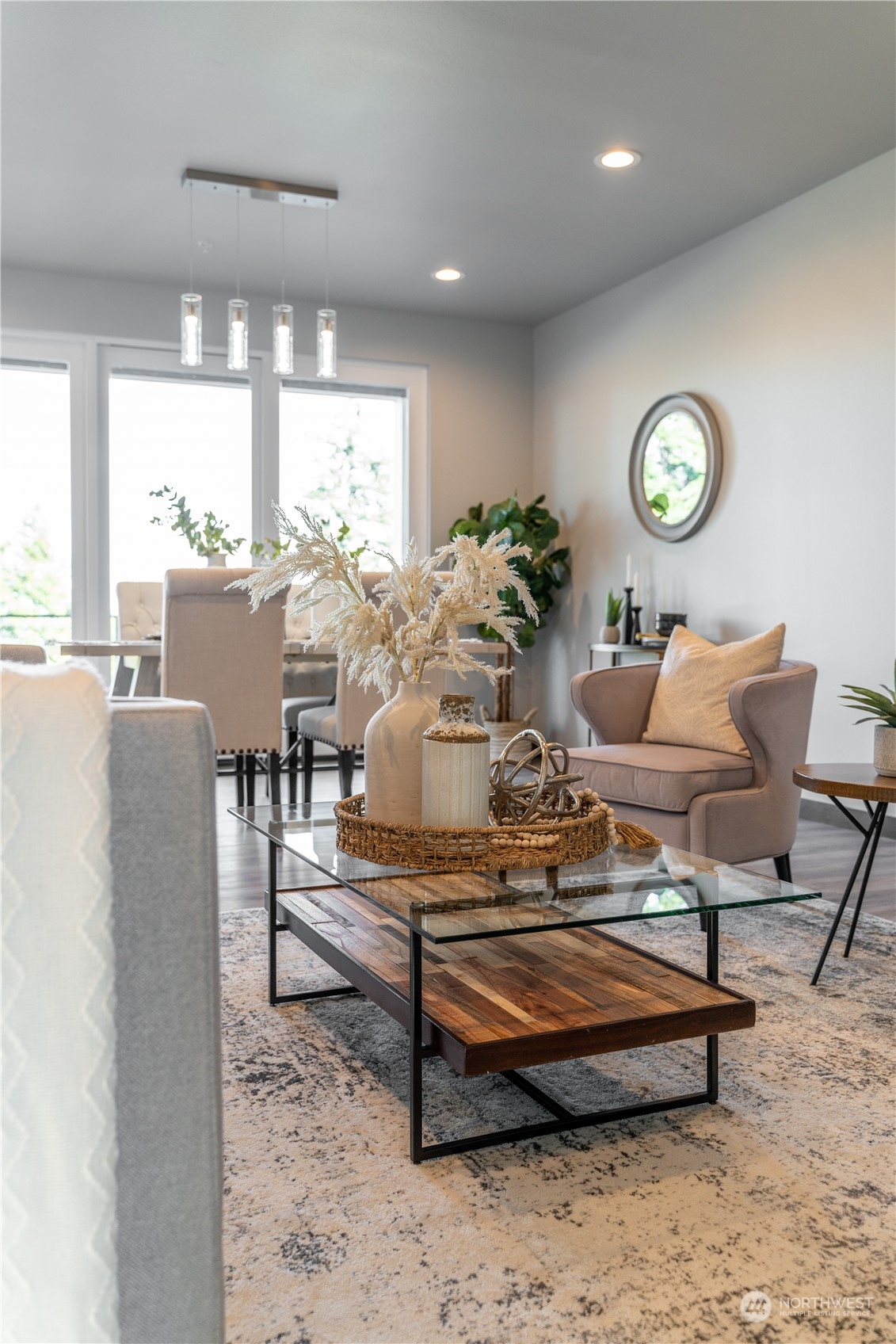 6441 Humphrey Road, Unit 4 Clinton, WA 98236 - Photo 16 of 40 a living room with patio furniture and a table