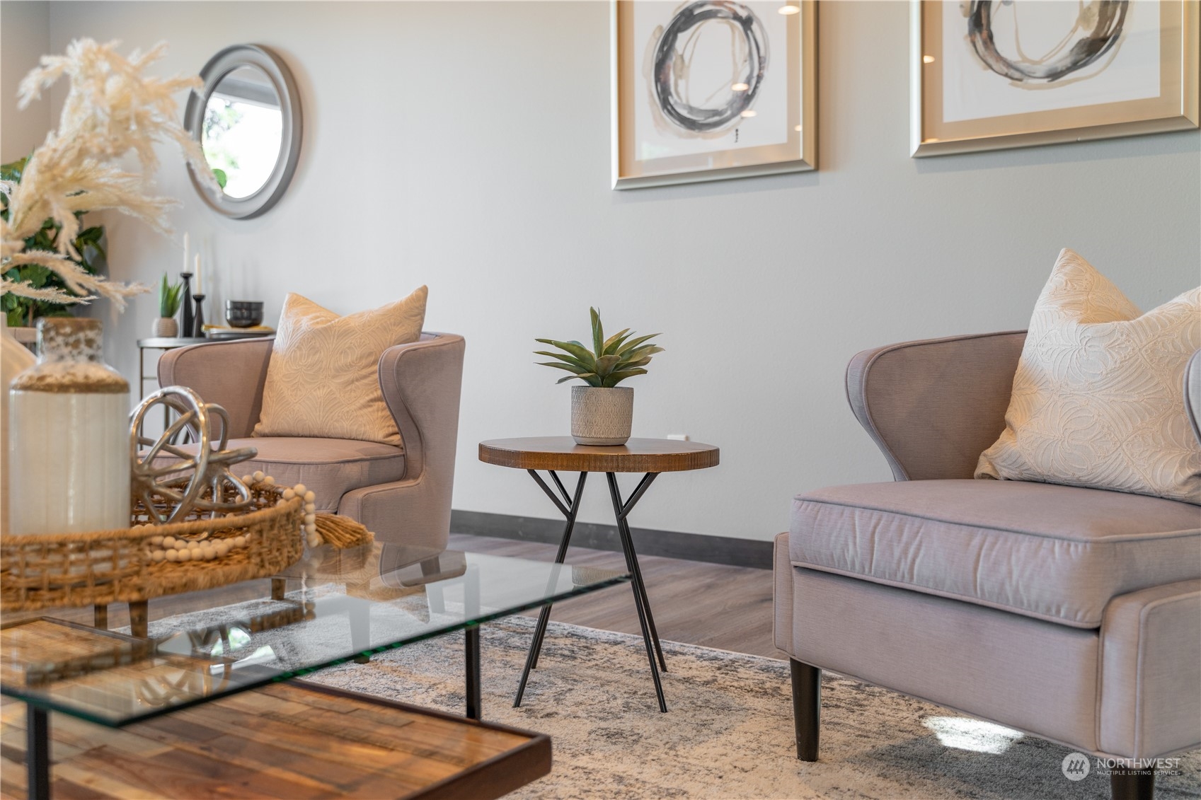 6441 Humphrey Road, Unit 4 Clinton, WA 98236 - Photo 17 of 40 a living room with furniture a mirror potted plant and a lamp