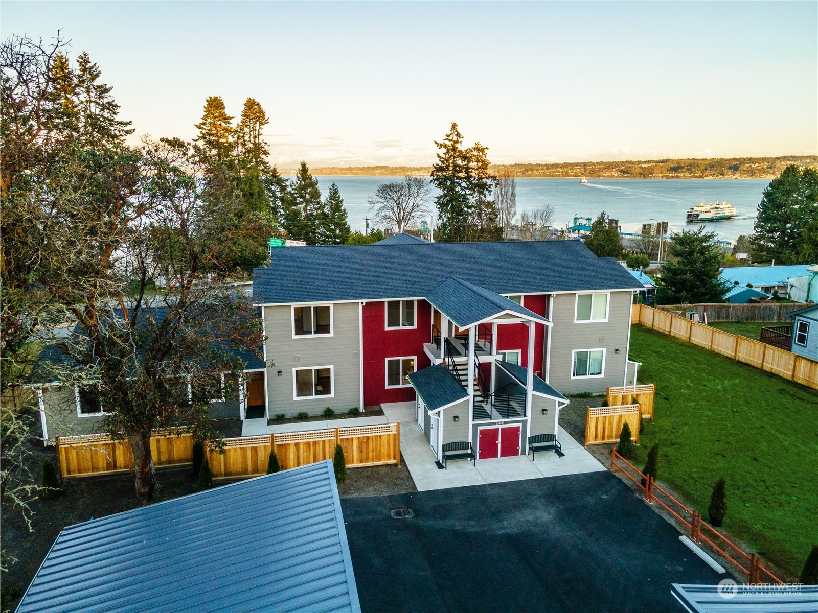 6441 Humphrey Road, Unit 4 Clinton, WA 98236 - Photo 31 of 40 a view of a house with pool and chairs