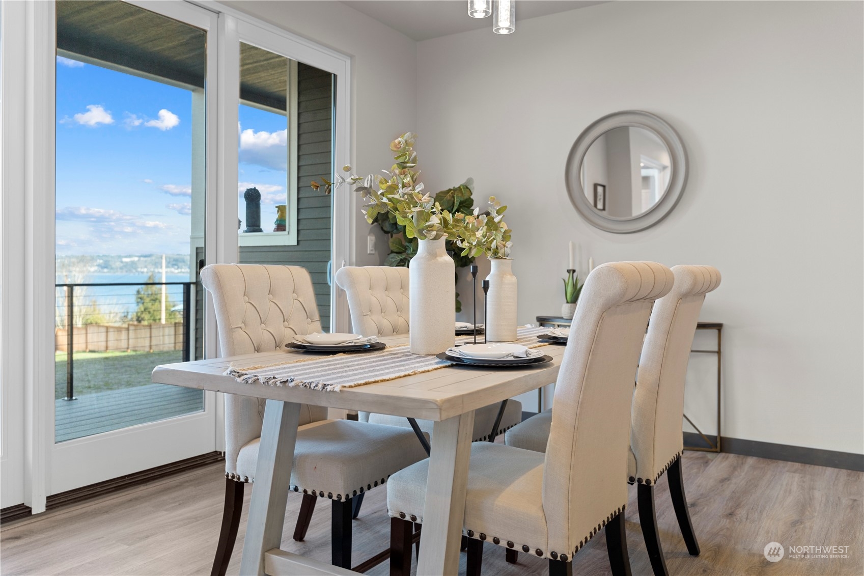 6441 Humphrey Road, Unit 4 Clinton, WA 98236 - Photo 8 of 40 a view of a dining room with furniture and a large window