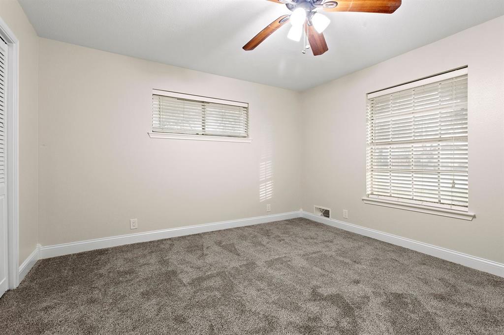 527 East Spring Valley Road Richardson, TX 75081 - Photo 13 of 19 a view of an empty room with a window