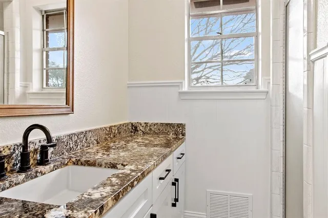 a view of cabinets and wooden floor