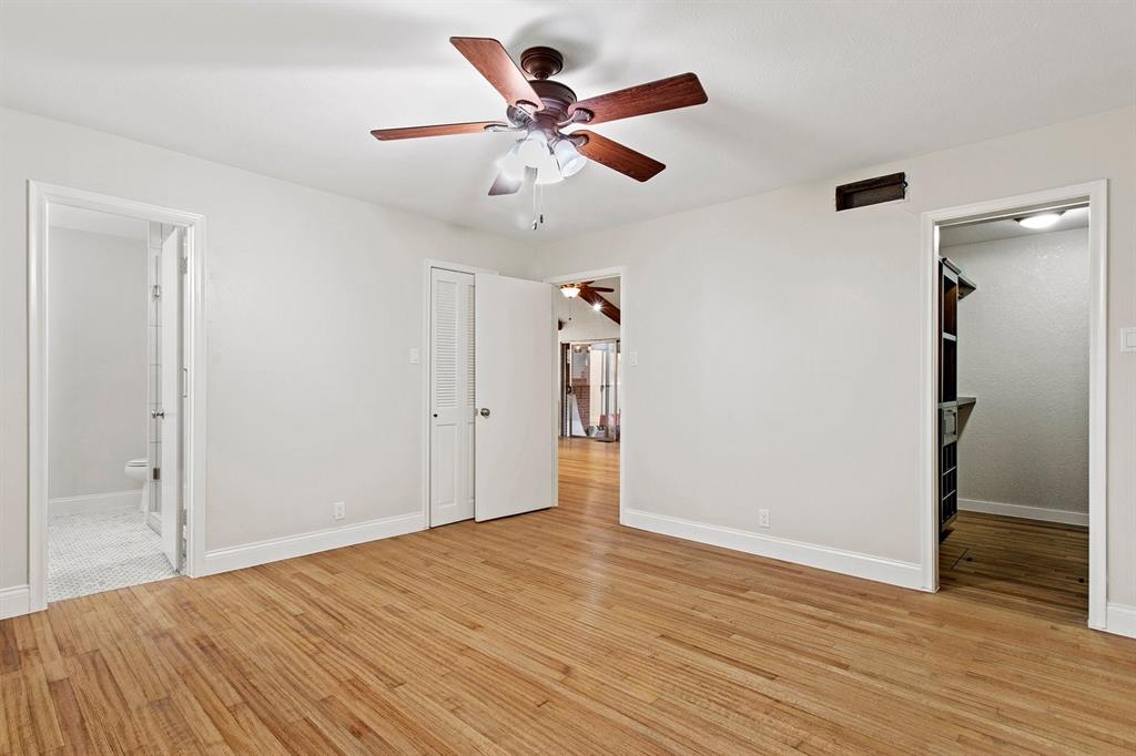527 East Spring Valley Road Richardson, TX 75081 - Photo 5 of 19 wooden floor in an empty room with wooden floor