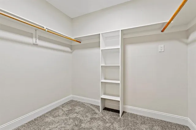 a white toilet sitting next to a bathroom