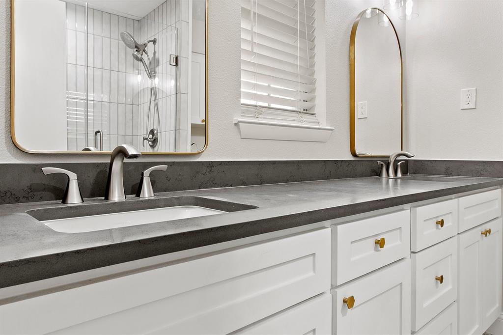 527 East Spring Valley Road Richardson, TX 75081 - Photo 10 of 19 a close view of sink and mirror