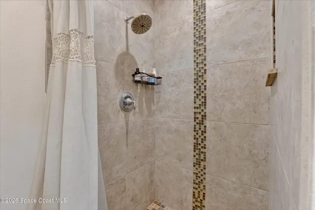 a bedroom with bed and a window