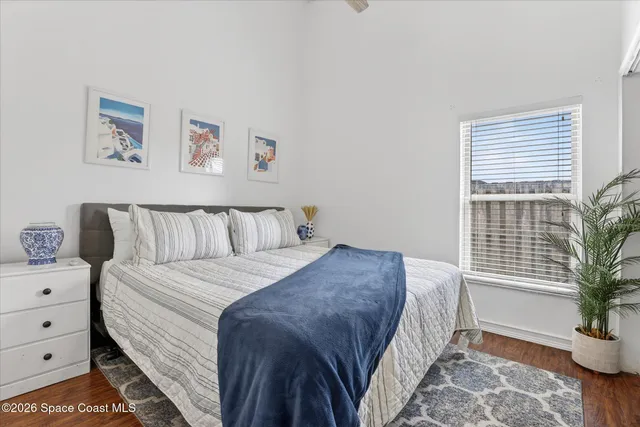 a bedroom with a bed and cabinet