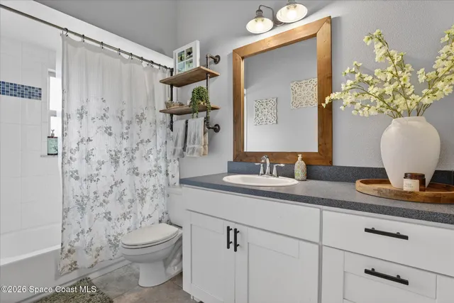 a workspace with furniture and a potted plant
