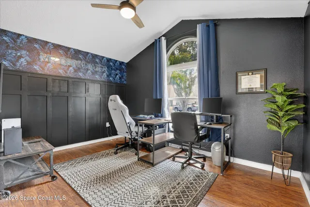 a bed room with a bed and a chair