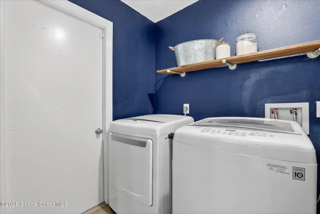 a view of a house with backyard and porch