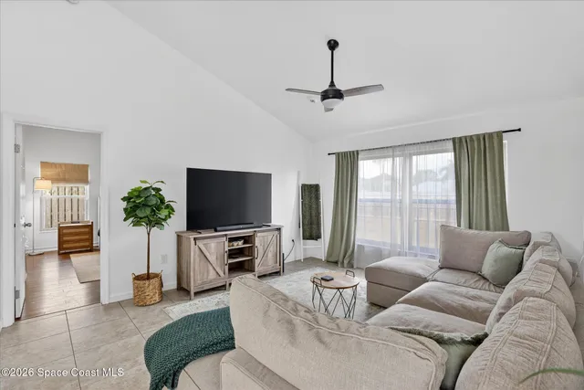 a dining room with a wooden table and chairs