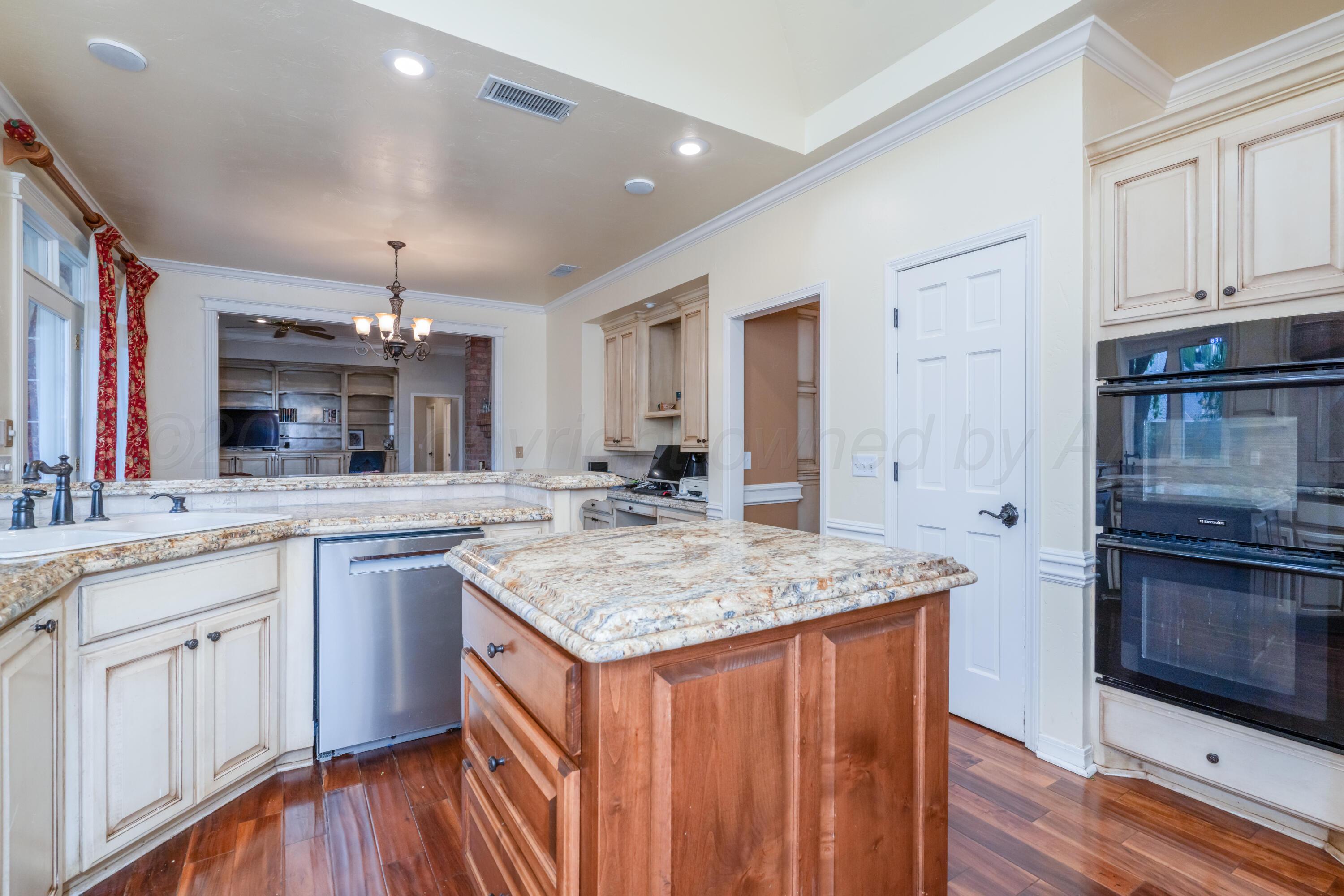 3501 Van Winkle Drive Amarillo, TX 79121 - Photo 12 of 35 a kitchen with stainless steel appliances granite countertop a sink stove and refrigerator