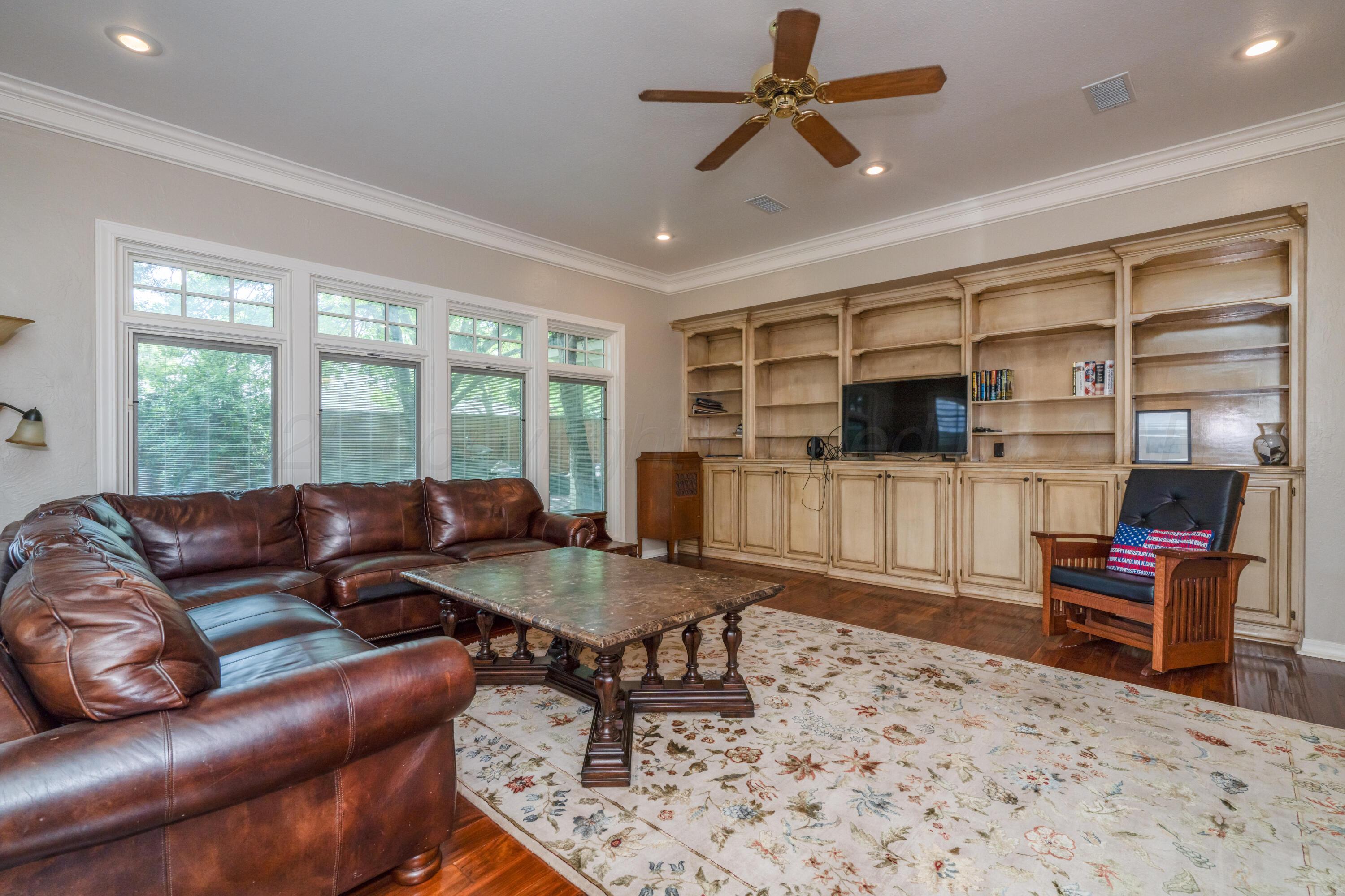 3501 Van Winkle Drive Amarillo, TX 79121 - Photo 19 of 35 a living room with furniture and a flat screen tv