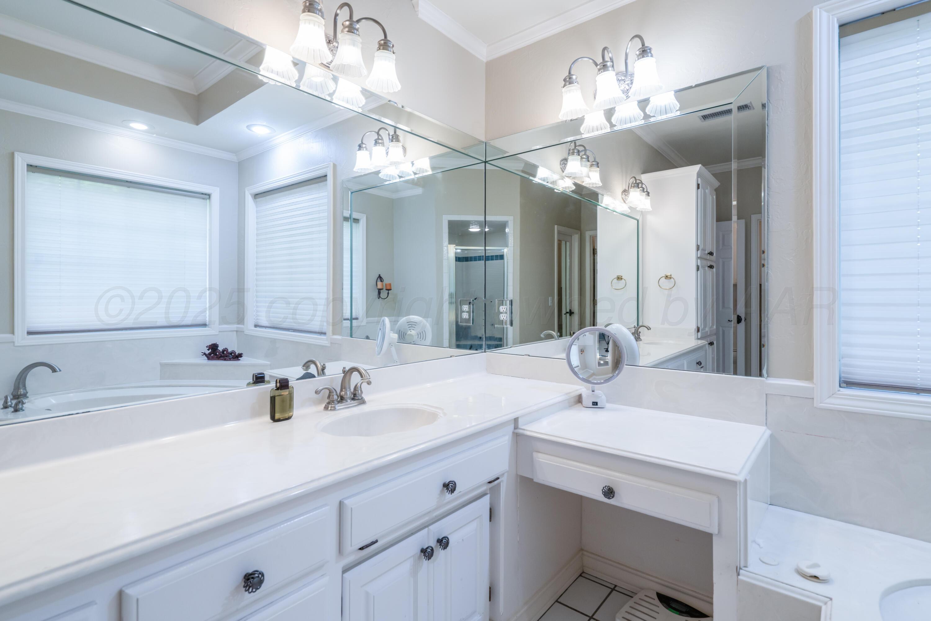 3501 Van Winkle Drive Amarillo, TX 79121 - Photo 22 of 35 a bathroom with a sink double vanity and a mirror