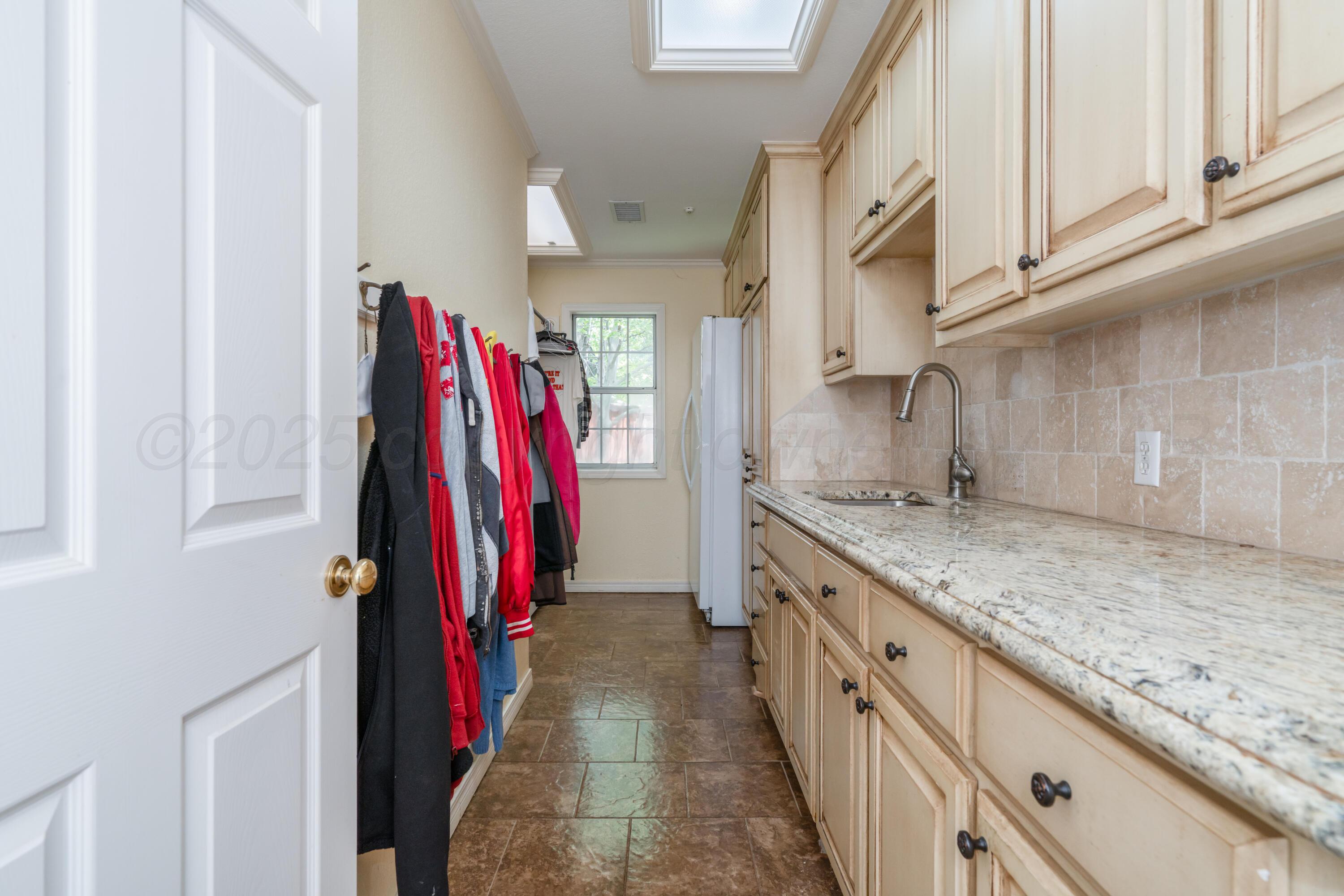 3501 Van Winkle Drive Amarillo, TX 79121 - Photo 31 of 35 a kitchen with stainless steel appliances granite countertop a sink and a refrigerator