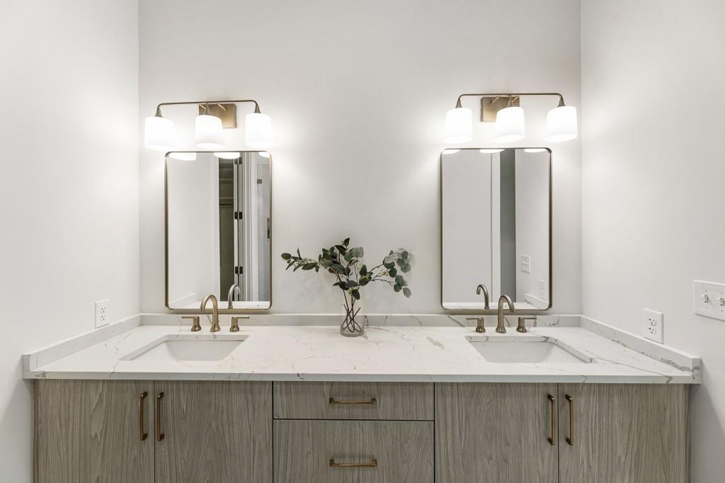 12455 Broadwell Road, Unit 202 Milton, GA 30004 - Photo 27 of 31 a bathroom with double vanity sinks and a mirror