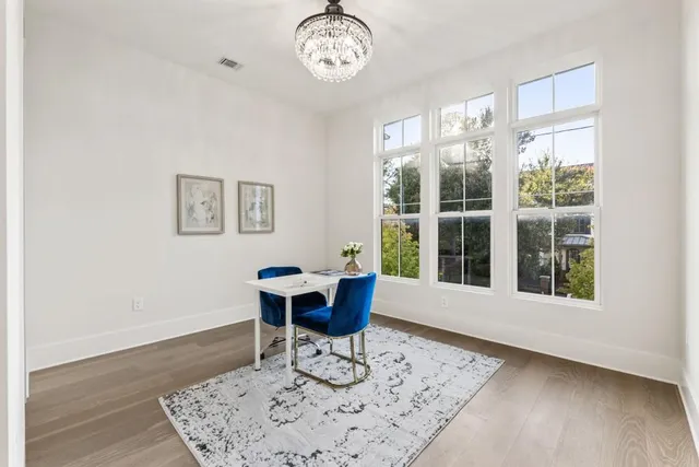 a workspace with furniture and wooden floor