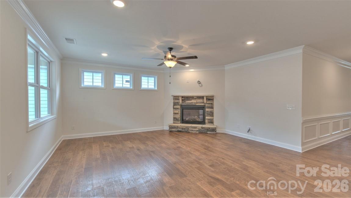 649 River Btm Road Fletcher, NC 28732 - Photo 16 of 40 an empty room with windows and ceiling fan