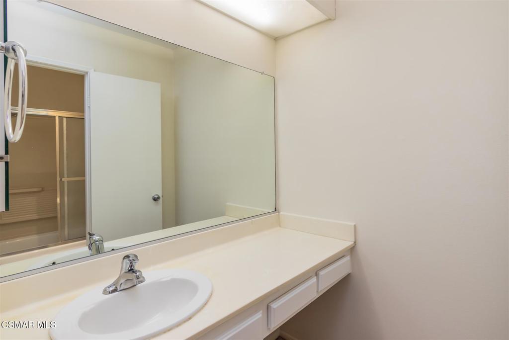 15175 Marquette Street, Unit D Moorpark, CA 93021 - Photo 11 of 22 a bathroom with a sink and a mirror