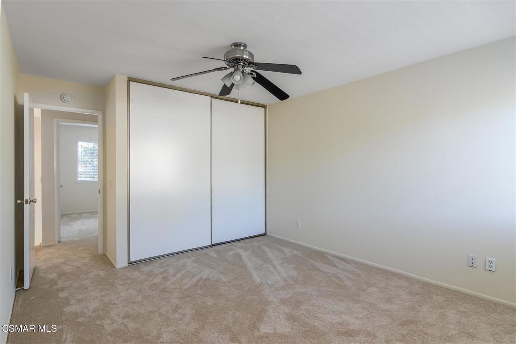 15175 Marquette Street, Unit D Moorpark, CA 93021 - Photo 13 of 22 an empty room with closet and a chandelier fan
