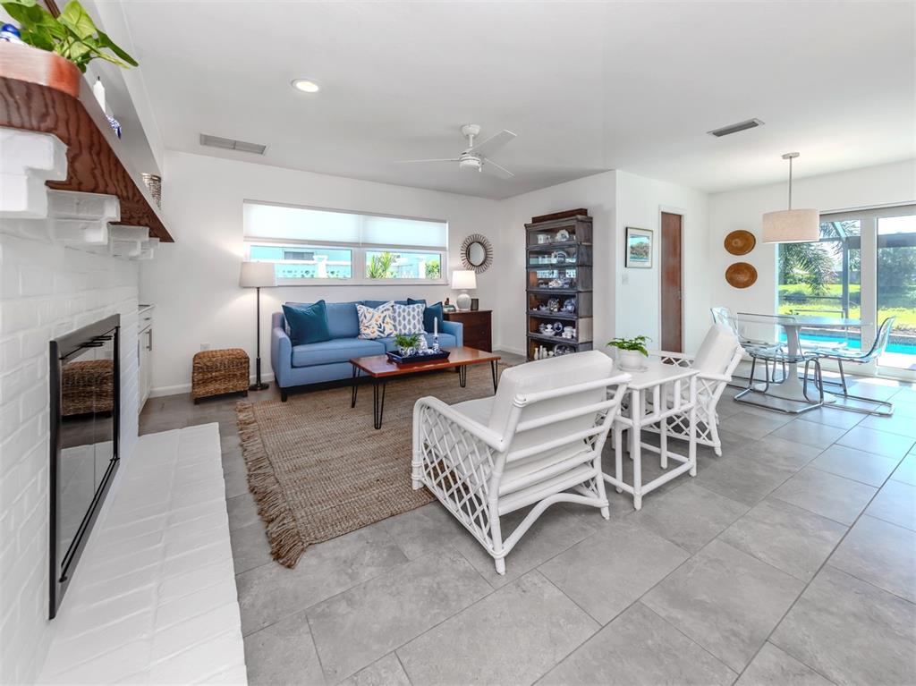 1228 Pine Needle Road Venice, FL 34285 - Photo 17 of 84 Family Room with cozy Fireplace