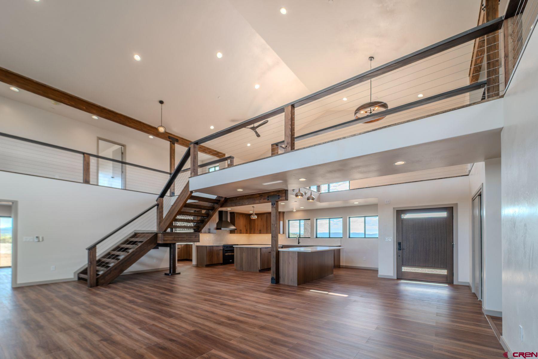 2077 Wrangler Way Durango, CO 81303 - Photo 11 of 43 a view of an entryway with wooden floor