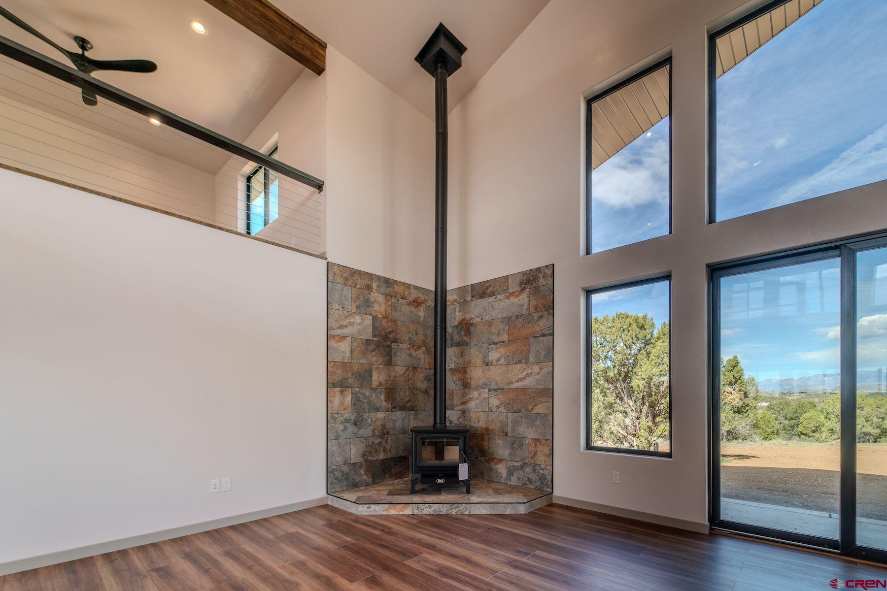 2077 Wrangler Way Durango, CO 81303 - Photo 14 of 43 a view of a room with wooden floor and windows