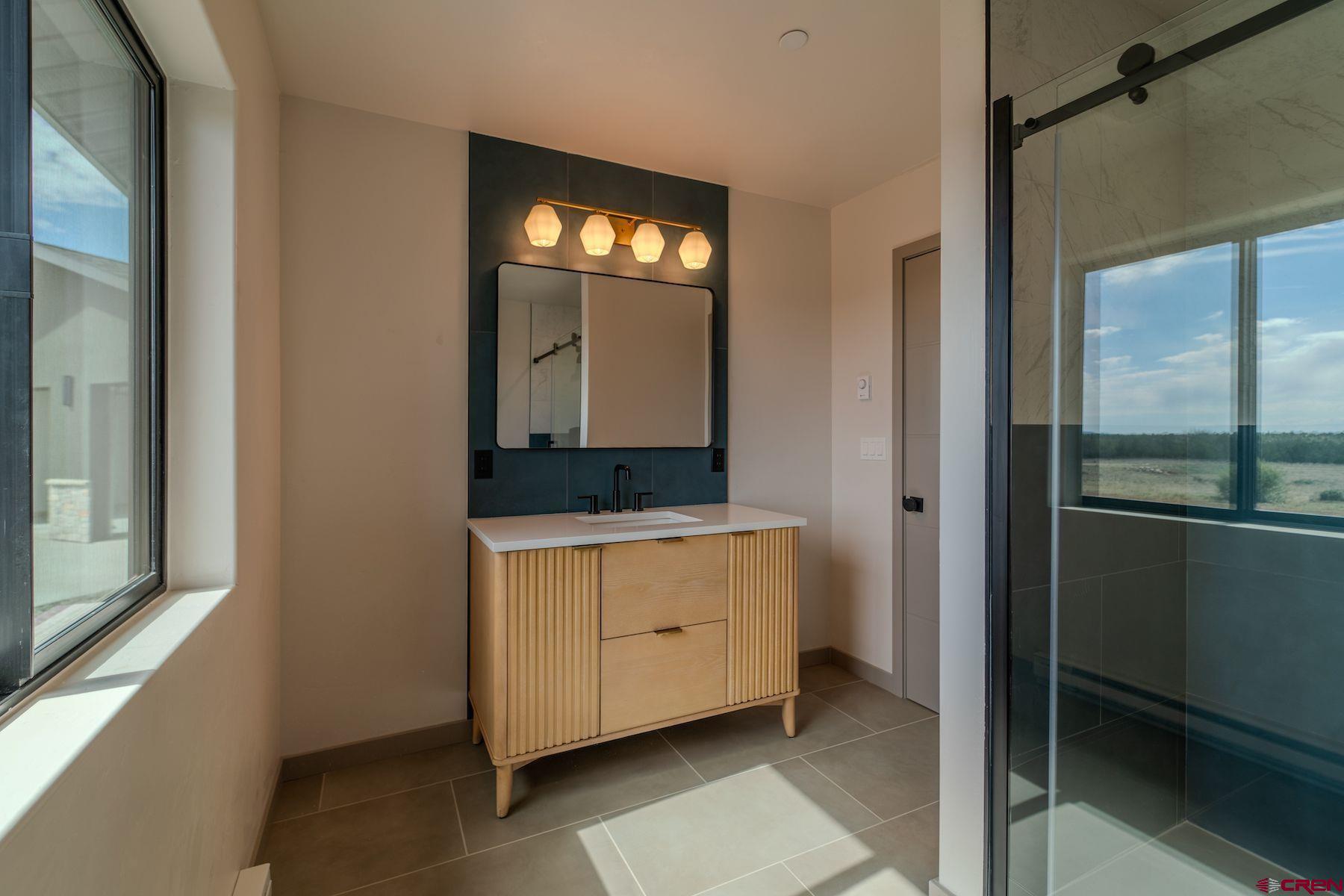 2077 Wrangler Way Durango, CO 81303 - Photo 16 of 43 a room with window and mirror