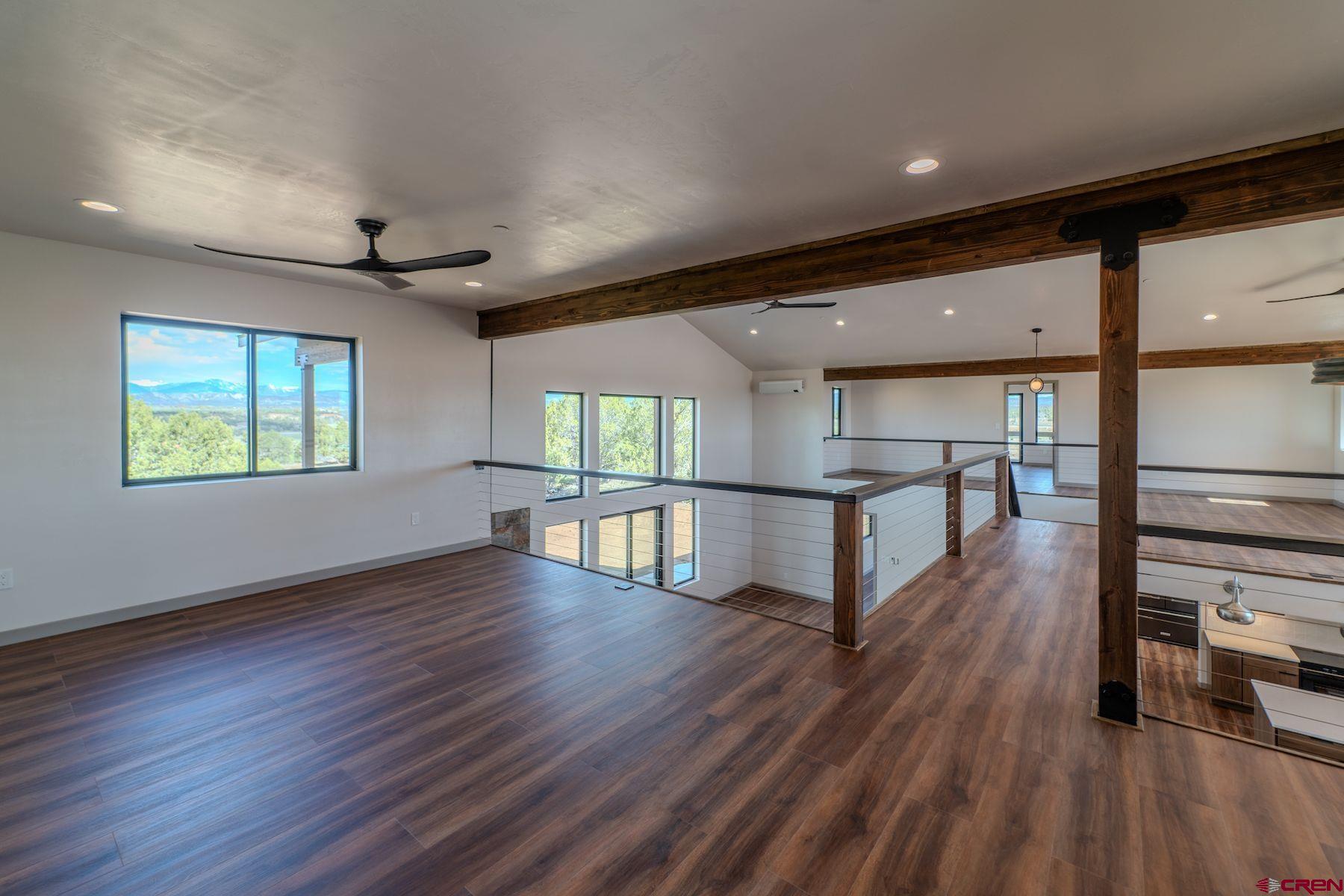 2077 Wrangler Way Durango, CO 81303 - Photo 21 of 43 a view of an entryway with wooden floors