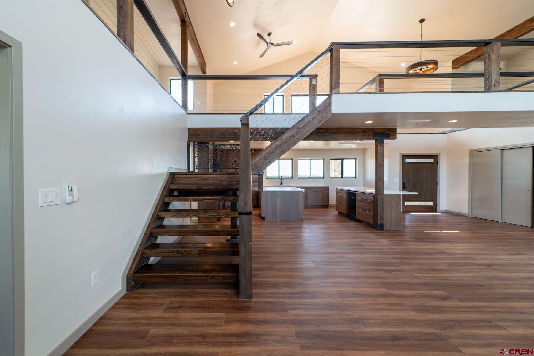 2077 Wrangler Way Durango, CO 81303 - Photo 21 of 45 a view of entryway and hall with wooden floor