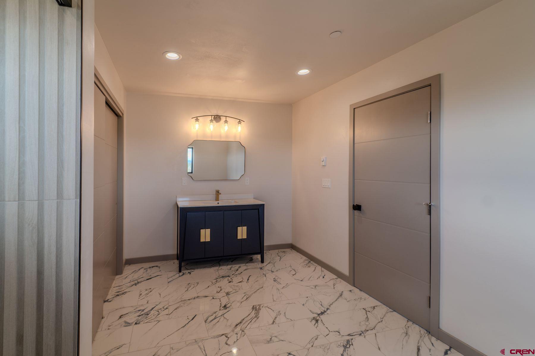 2077 Wrangler Way Durango, CO 81303 - Photo 27 of 43 a view of a hallway to a room with a front door