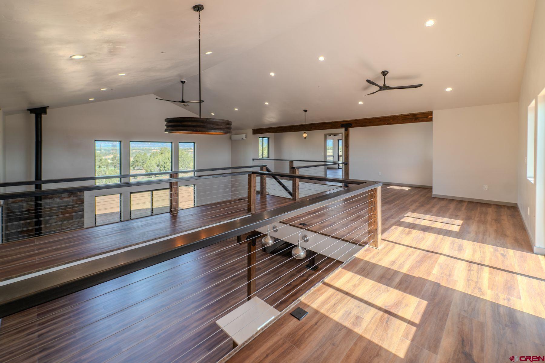 2077 Wrangler Way Durango, CO 81303 - Photo 29 of 43 a view of a room with wooden floor