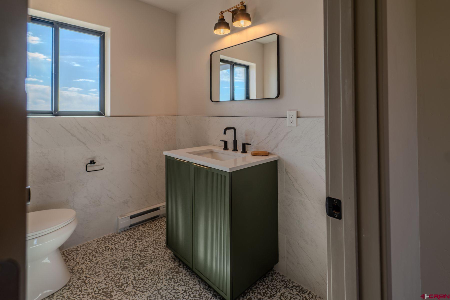 2077 Wrangler Way Durango, CO 81303 - Photo 30 of 43 a bathroom with a sink and a toilet