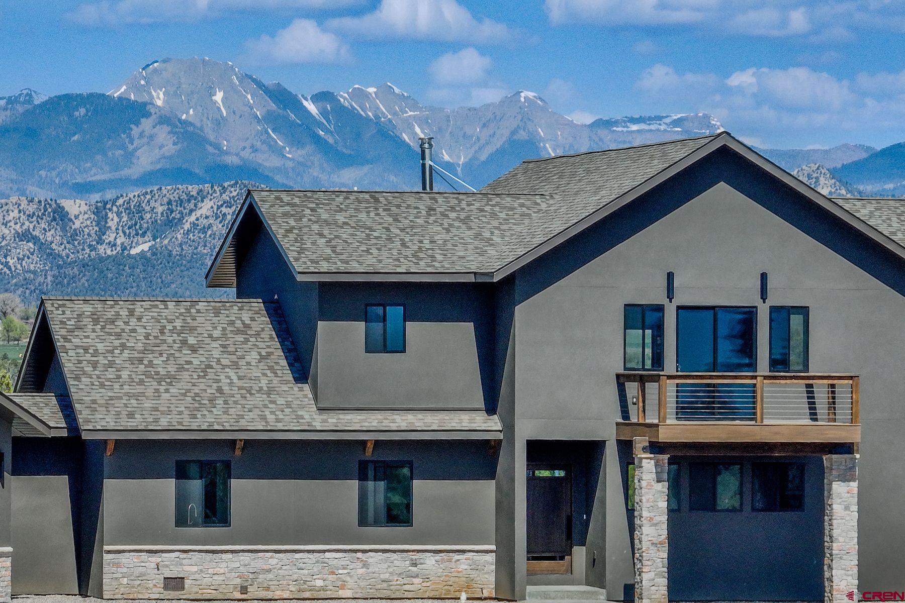 2077 Wrangler Way Durango, CO 81303 - Photo 38 of 43 a front view of a house with glass windows