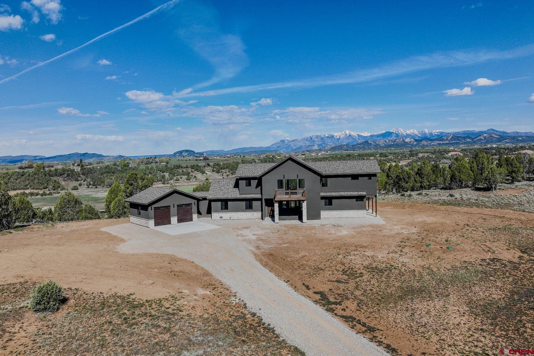 2077 Wrangler Way Durango, CO 81303 - Photo 40 of 43 a view of a house with a big yard