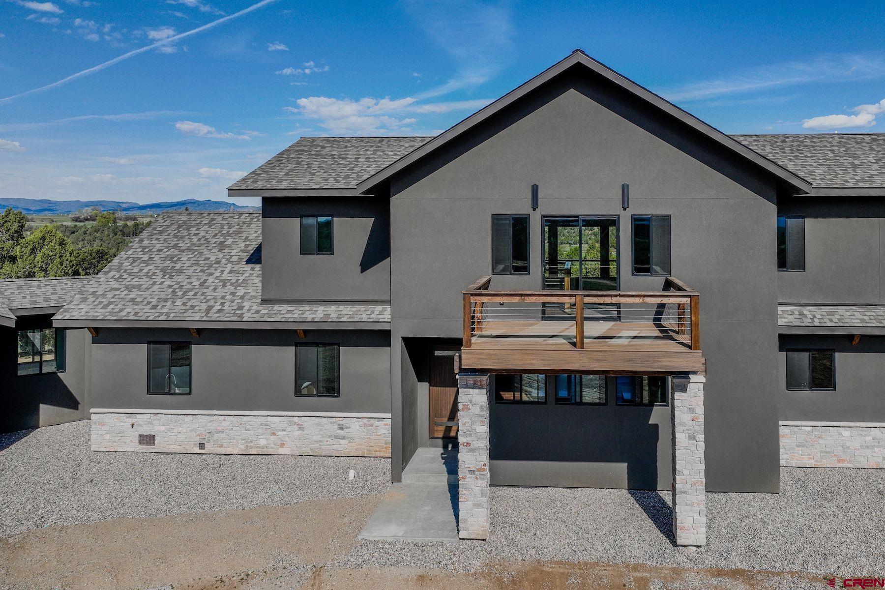 2077 Wrangler Way Durango, CO 81303 - Photo 44 of 45 a front view of a house with a porch