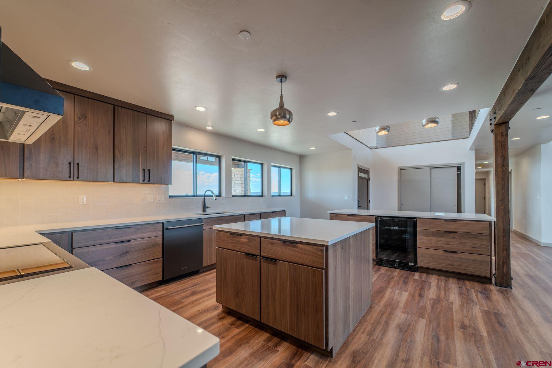 2077 Wrangler Way Durango, CO 81303 - Photo 5 of 43 a kitchen with stainless steel appliances granite countertop a sink stove and refrigerator