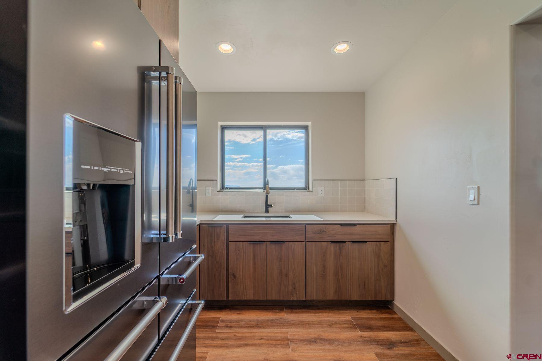 2077 Wrangler Way Durango, CO 81303 - Photo 9 of 43 a kitchen with a sink and cabinets