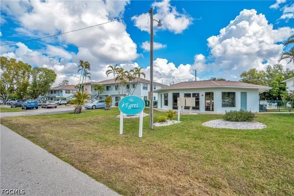 a view of a house with a yard porch and sitting area
