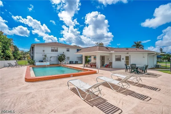 an aerial view of a house with a swimming pool