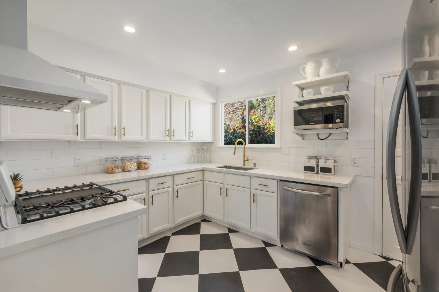 419 Millwood Drive Millbrae, CA 94030 - Photo 11 of 32 a kitchen with a sink a stove and refrigerator