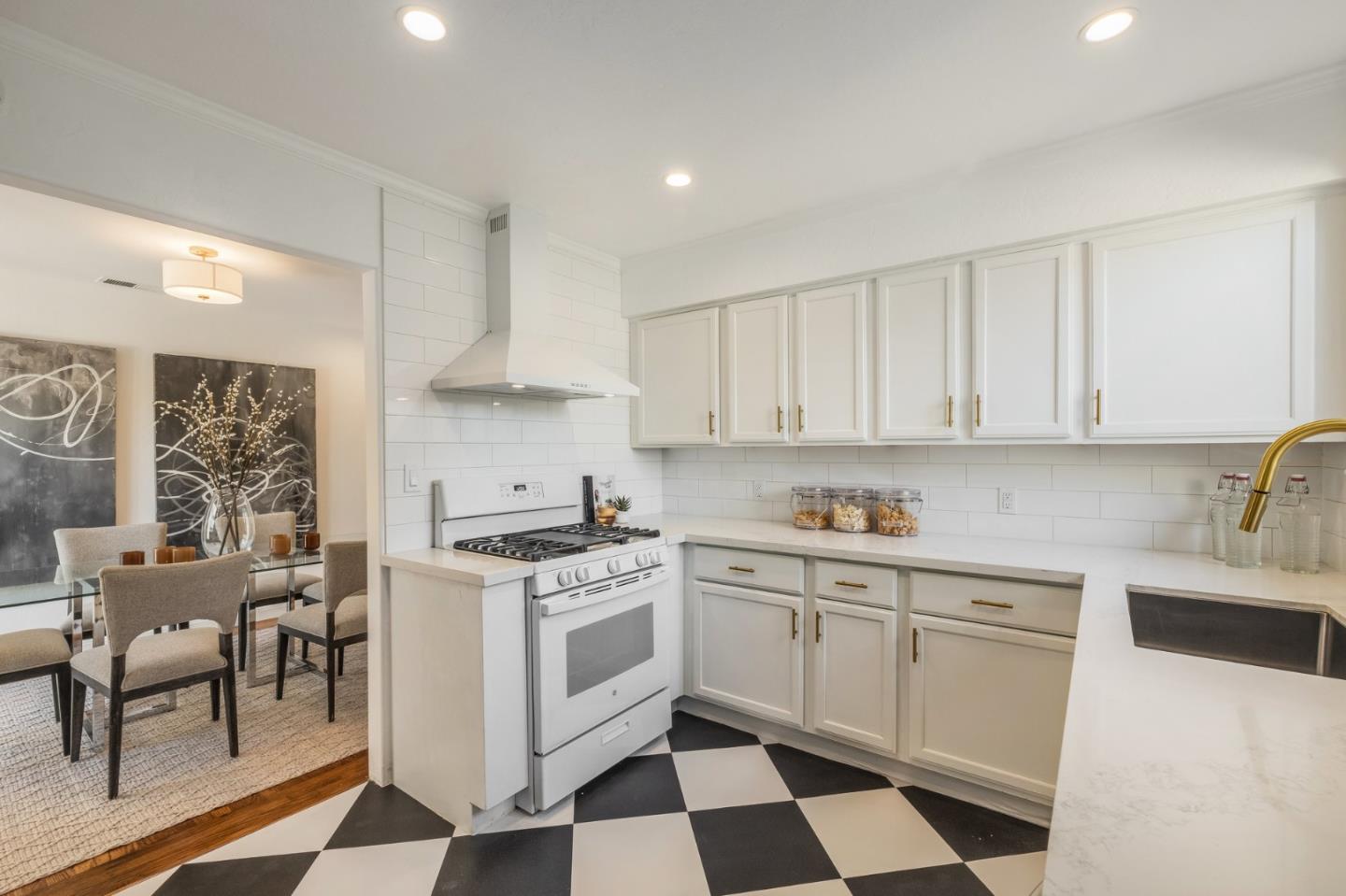 419 Millwood Drive Millbrae, CA 94030 - Photo 12 of 32 a kitchen with a stove top oven sink and cabinets